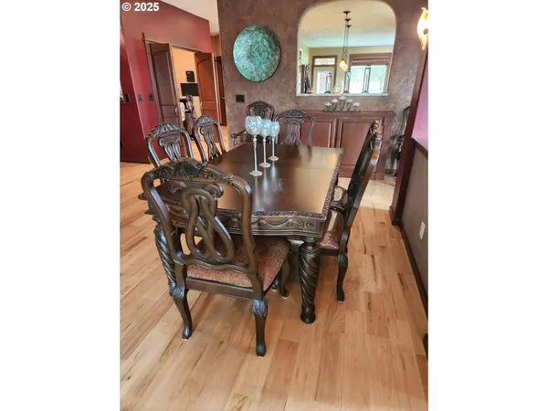 a dining room with furniture and window