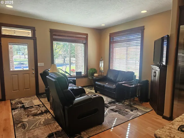 a living room with furniture and windows