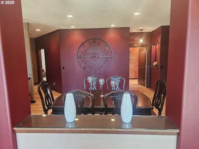 a view of dining table with chairs