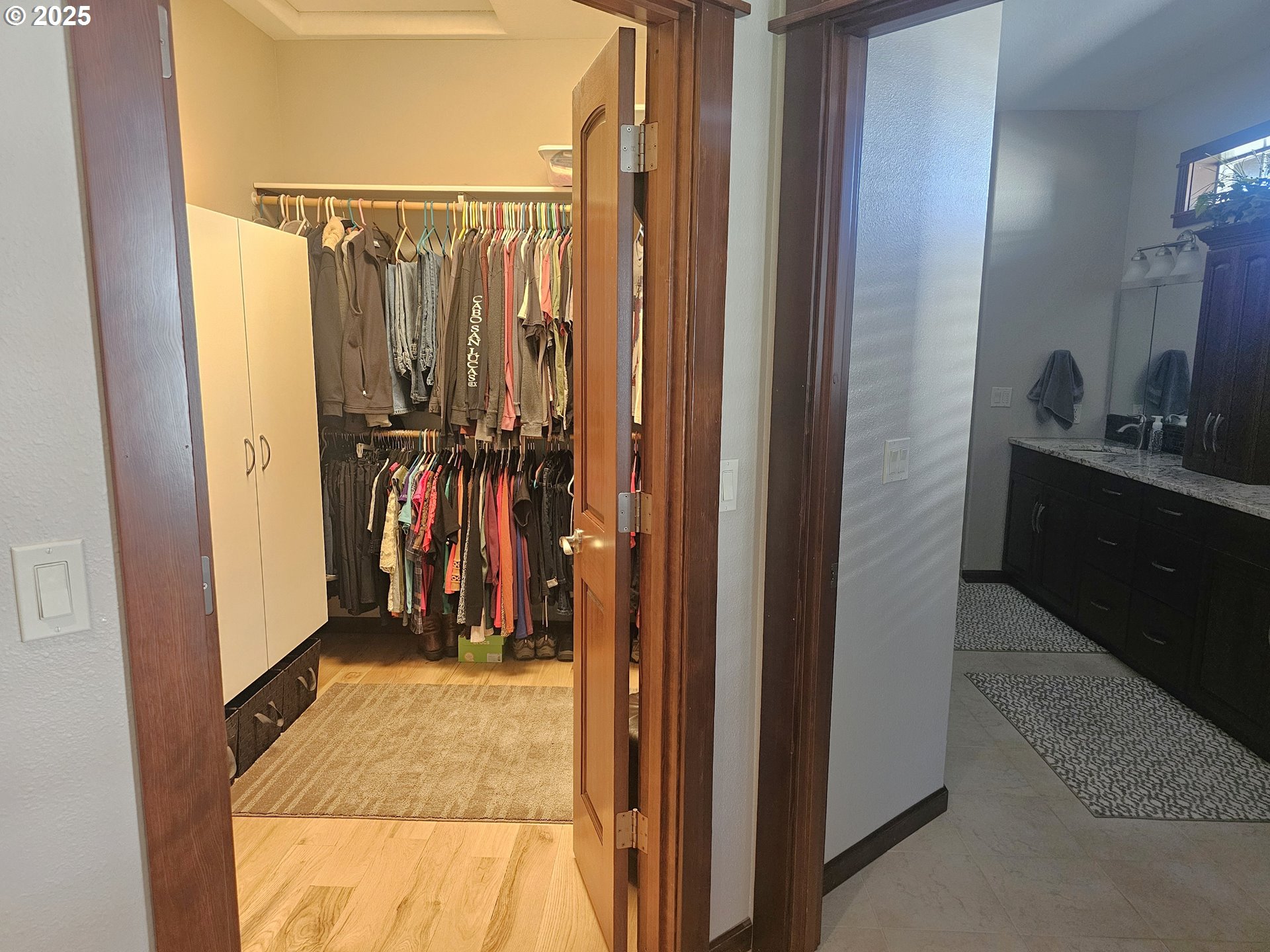 6481 Southwest Wren Lane Culver, OR 97734 - Photo 25 of 44 a view of walk in closet with clothes