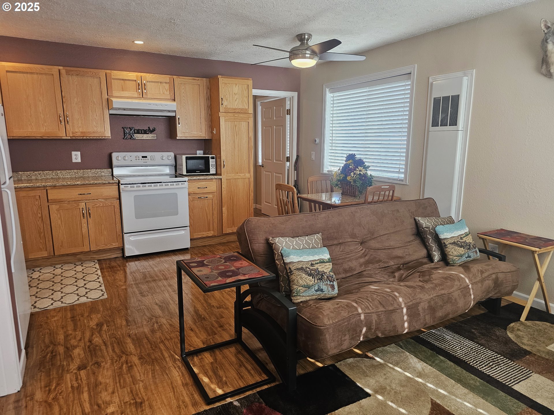 6481 Southwest Wren Lane Culver, OR 97734 - Photo 34 of 44 a living room with furniture and a wooden floor