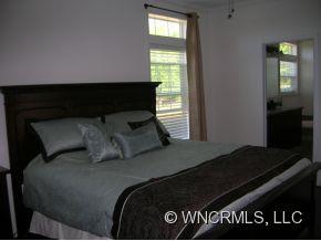 381 Weeks Road Rutherfordton, NC 28139 - Photo 8 of 12 a bed sitting in a bedroom next to a window