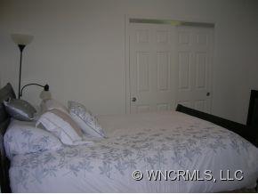 381 Weeks Road Rutherfordton, NC 28139 - Photo 9 of 12 a bedroom with a bed and a gate