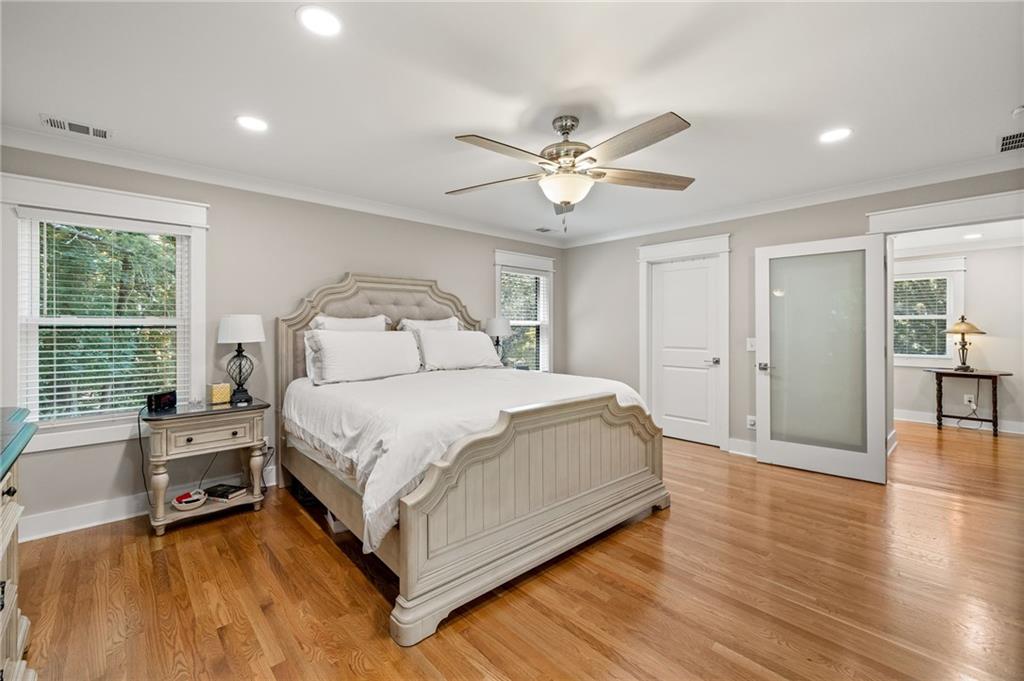 6470 Samoa Way Flowery Branch, GA 30542 - Photo 35 of 61 a spacious bedroom with a bed and a large window