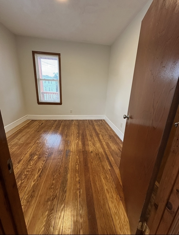 11 Tebroc Street, Unit 2 Boston, MA 02122 - Photo 15 of 17 wooden floor with window