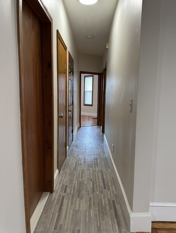 11 Tebroc Street, Unit 2 Boston, MA 02122 - Photo 16 of 17 a view of a hallway with wooden floor