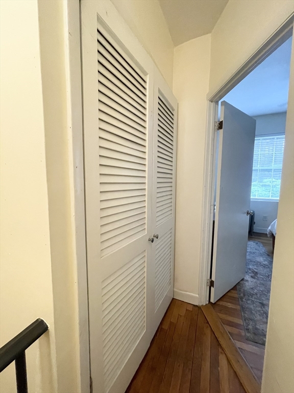 9 Primus Avenue, Unit 1 Boston, MA 02114 - Photo 12 of 19 a view of a hallway with wooden floor