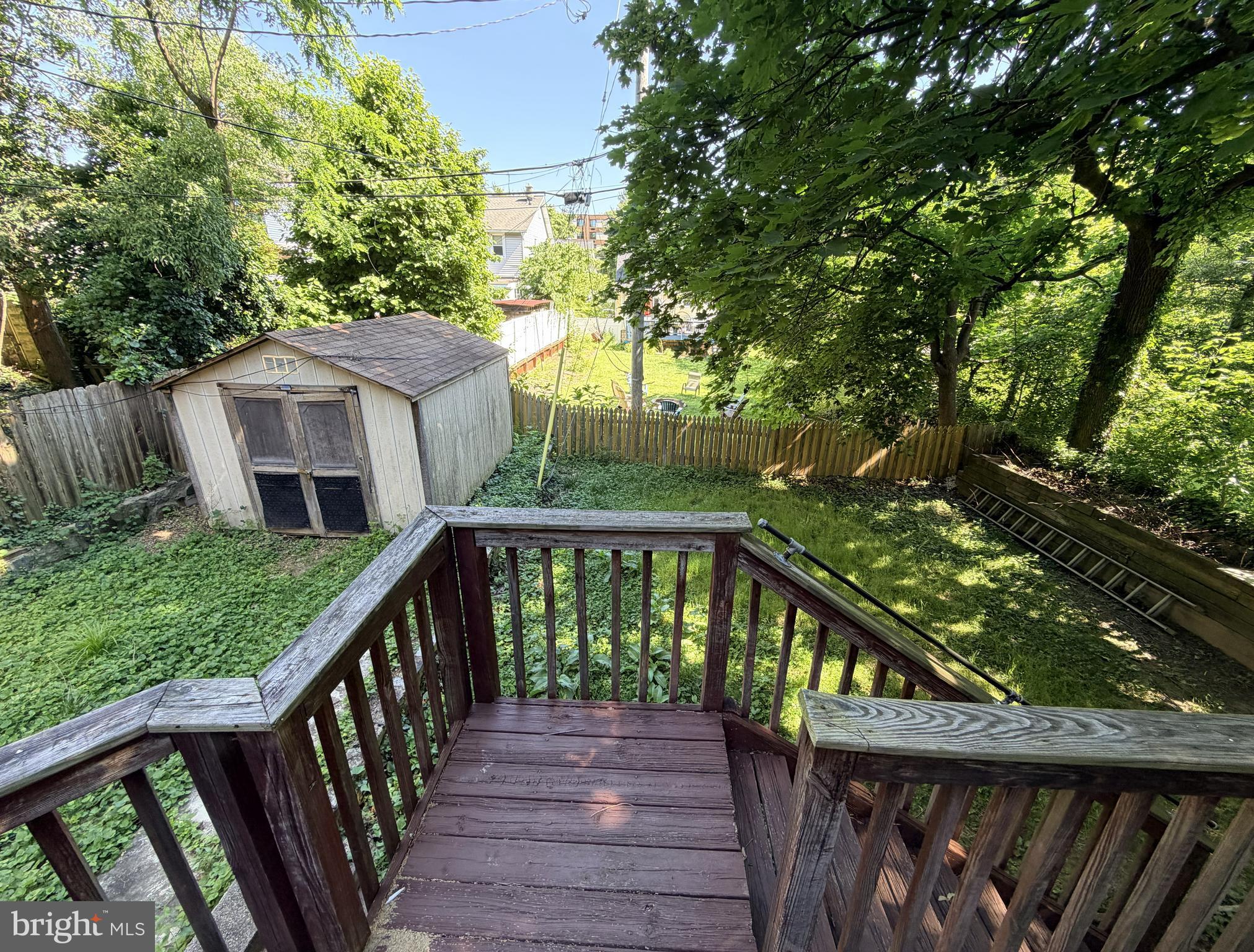 506 Cedarcroft Road Baltimore, MD 21212 - Photo 15 of 16 a view of a deck with wooden floor and fence