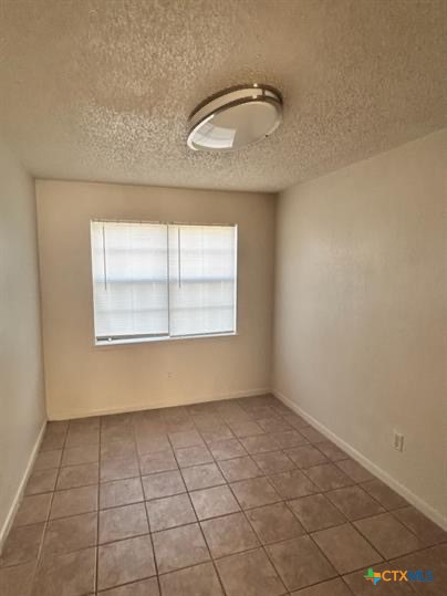 1109 Eastside Drive, Unit C Killeen, TX 76543 - Photo 3 of 9 an empty room with windows