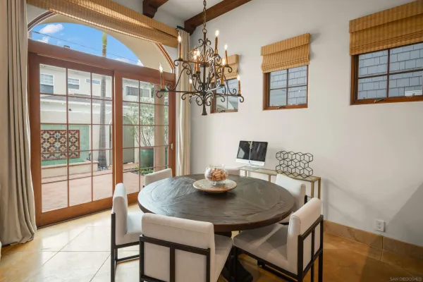 a view of a dining room with furniture and window