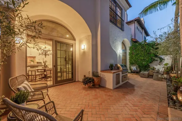a view of a patio with couches and potted plants