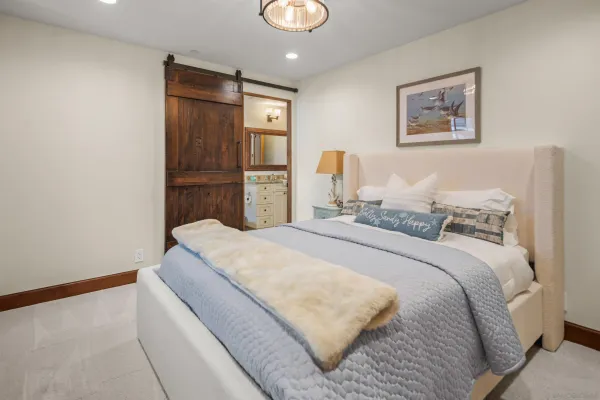 a bedroom with bed and window