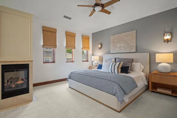 a bedroom with a bed and a fireplace