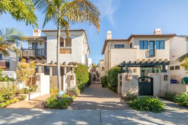 a front view of a residential apartment building with a yard