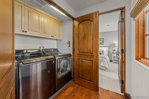 a kitchen with stainless steel appliances granite countertop a refrigerator and a stove
