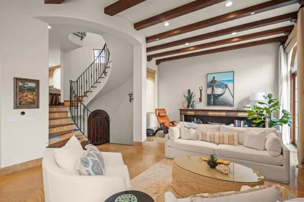 a living room with furniture and a painting