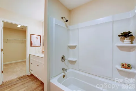 a bathroom with a tub and shower