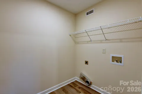 a room with shoes and wooden floor