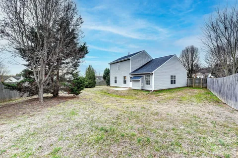 a house with trees in the background