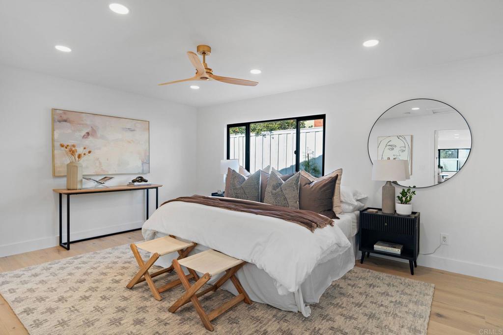 161 Countryhaven Road Encinitas, CA 92024 - Photo 12 of 26 a spacious bedroom with a bed a desk and chair