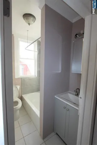 a bathroom with a bathtub and sink