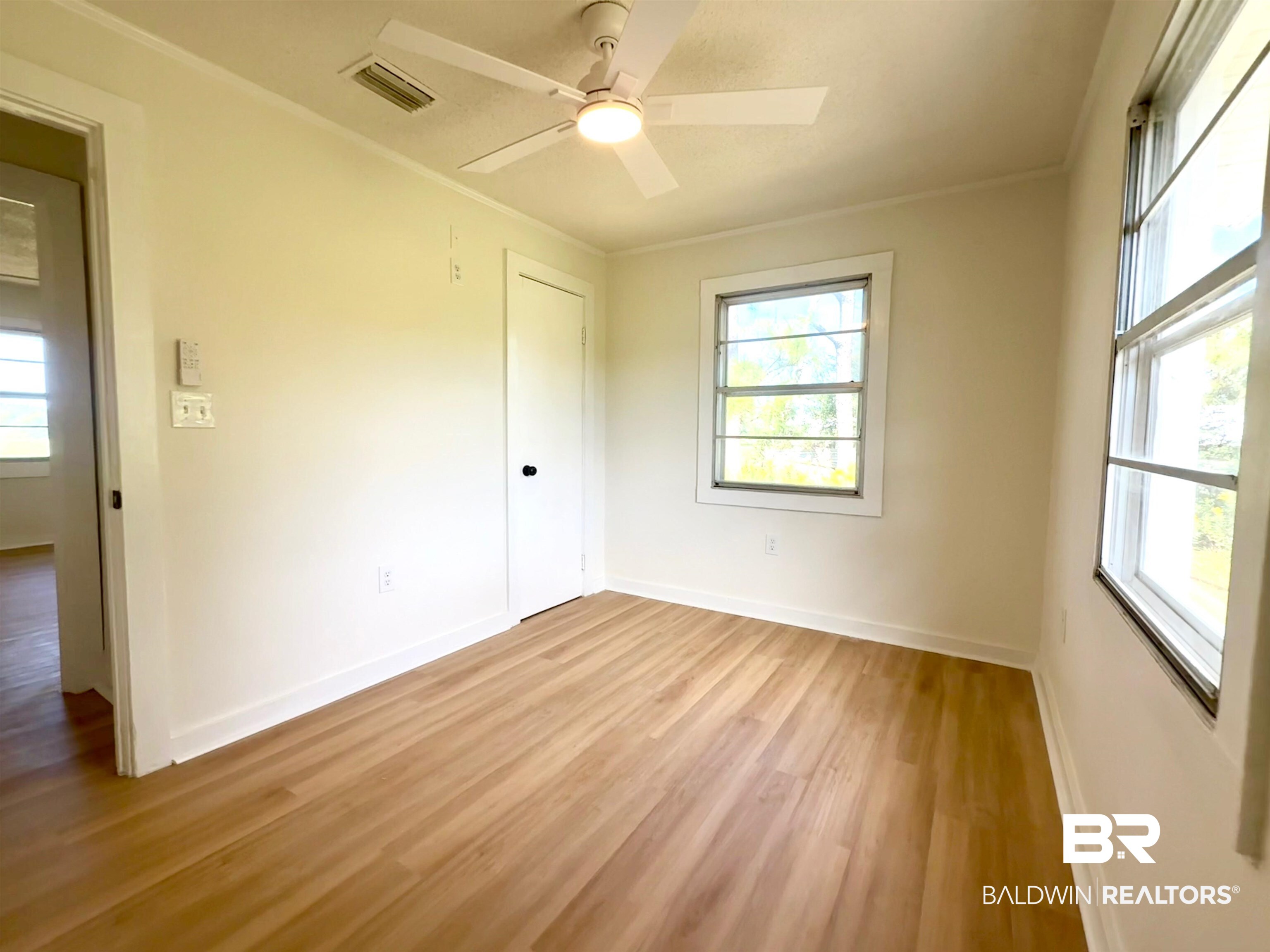 11698 Poser Road Foley, AL 36535 - Photo 15 of 20 Unfurnished bedroom with light wood finished floors, ceiling fan, and crown molding