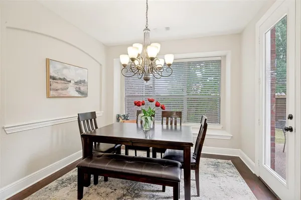 a view of a dining room with furniture and window