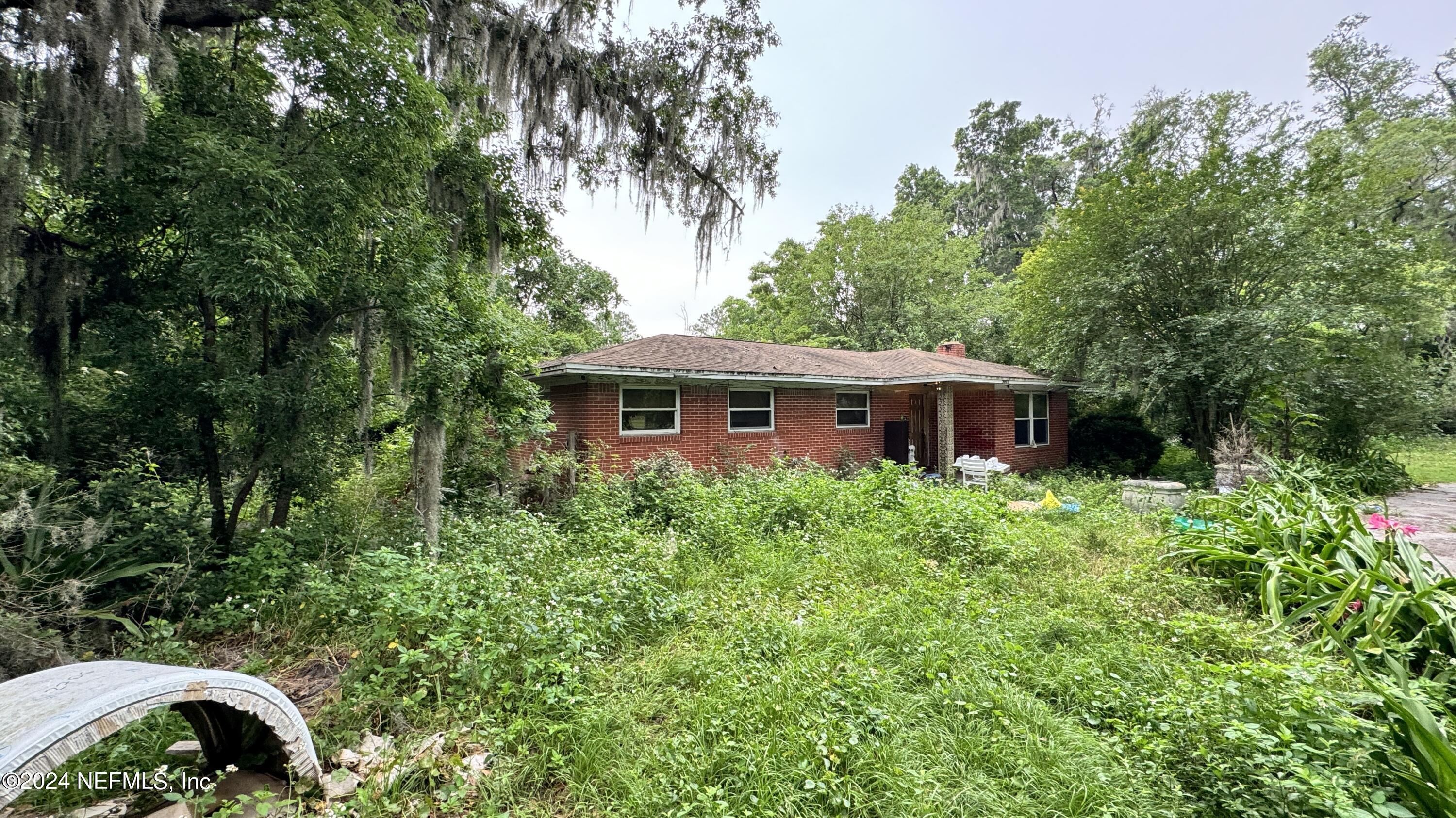 36107 Pine Street Hilliard, FL 32046 - Photo 17 of 27 a front view of a house with garden