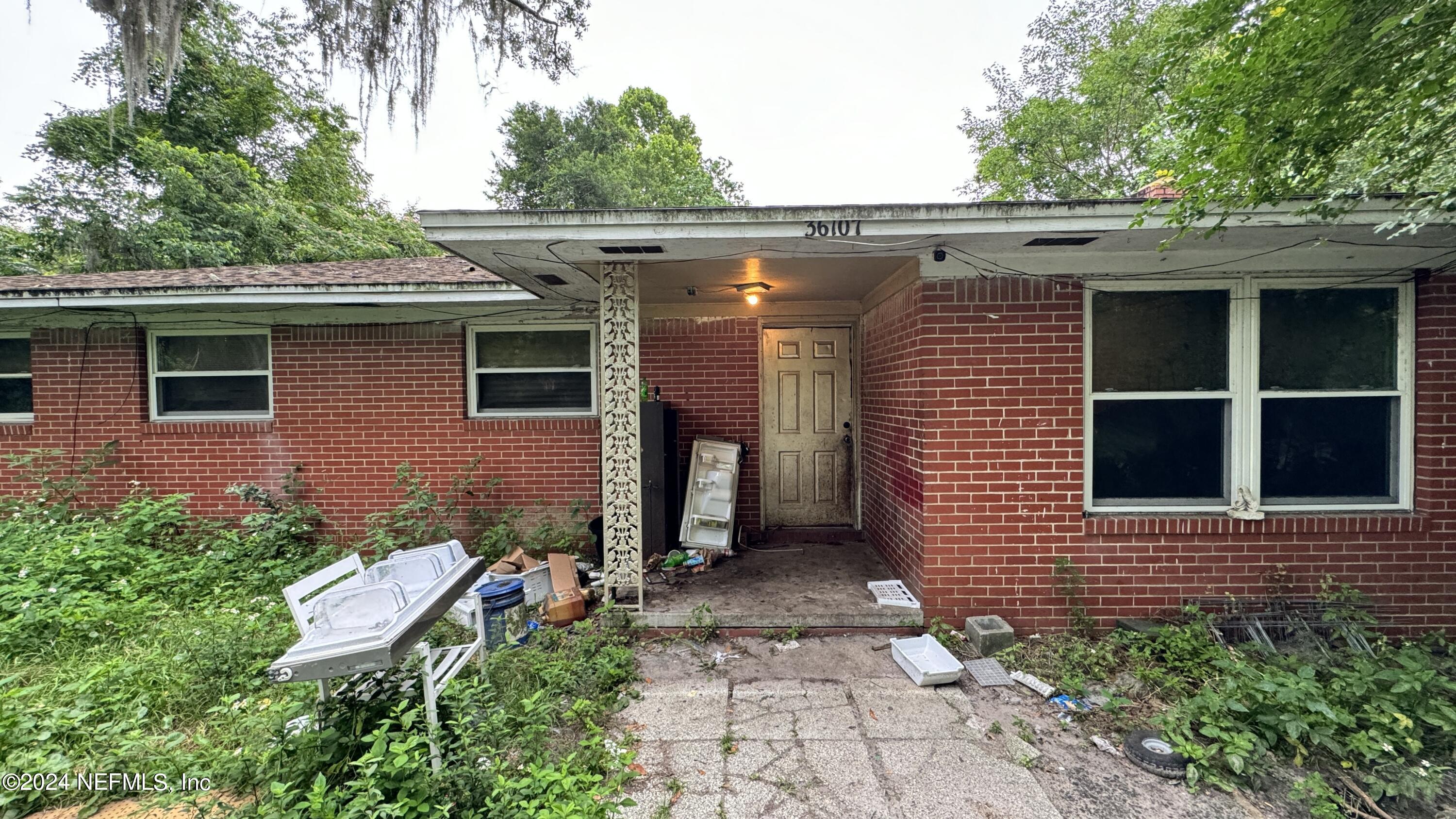 36107 Pine Street Hilliard, FL 32046 - Photo 18 of 27 a front view of a house with a yard