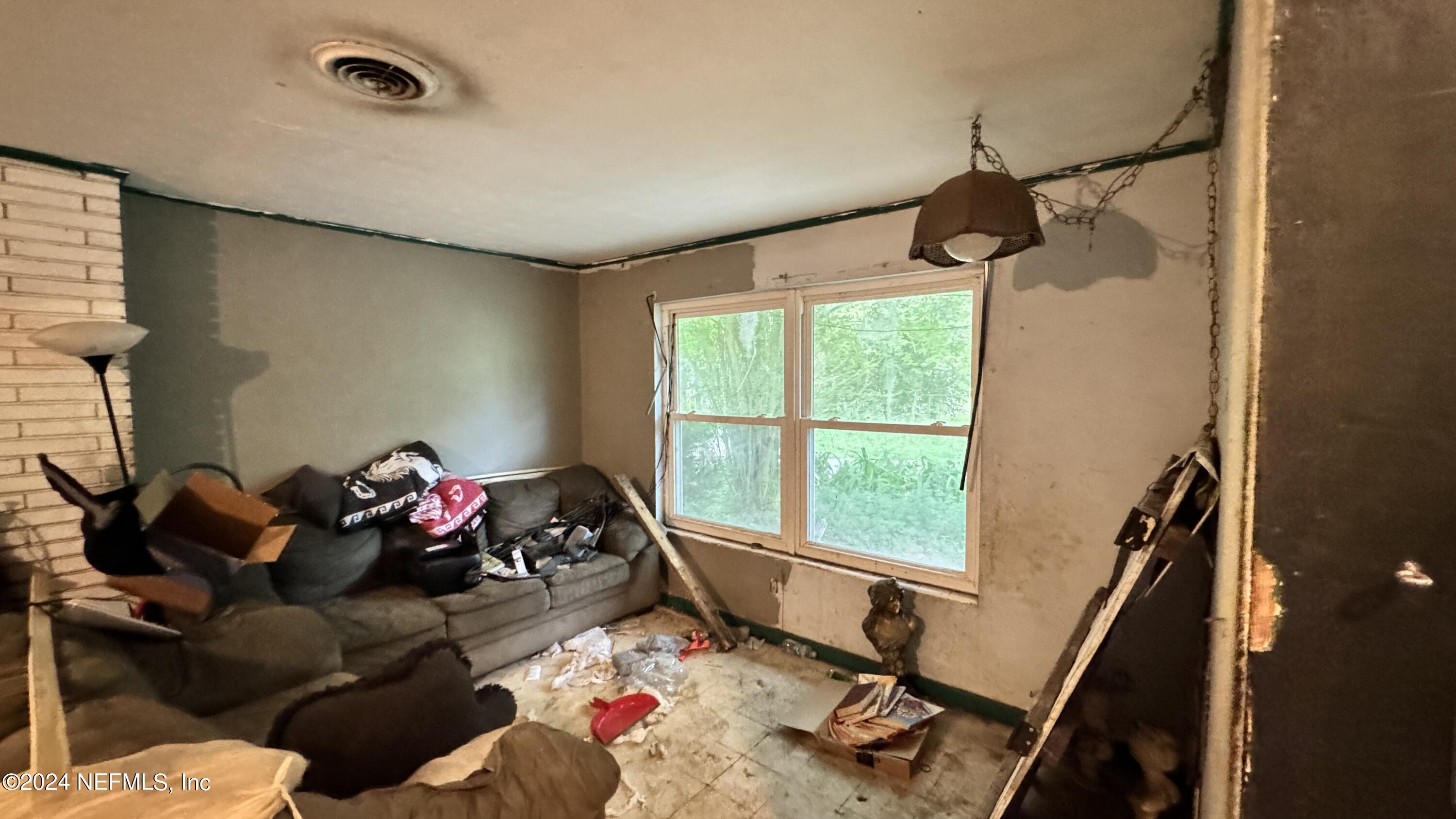 36107 Pine Street Hilliard, FL 32046 - Photo 22 of 27 a living room with furniture and a window