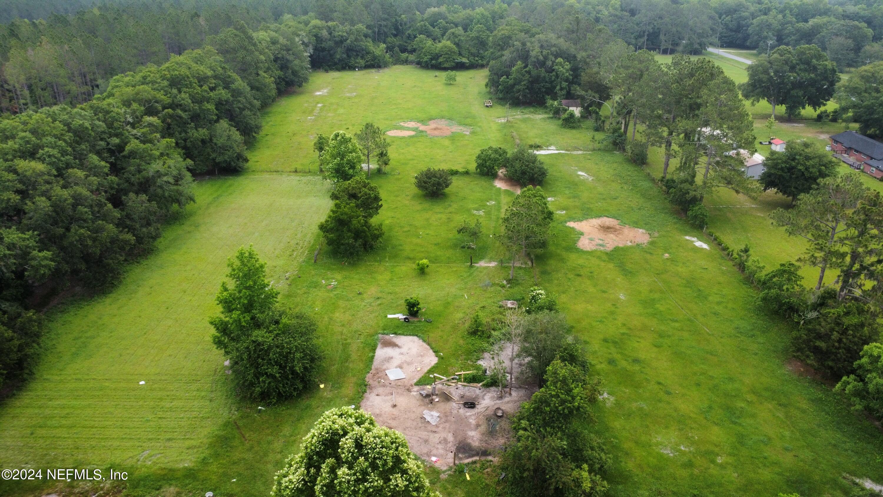 36107 Pine Street Hilliard, FL 32046 - Photo 4 of 27 a view of a lake with a yard