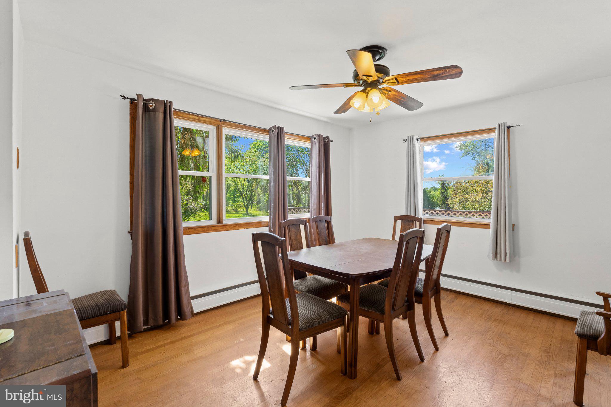 5422 Woodbine Road Woodbine, MD 21797 - Photo 10 of 39 Bright dining space with scenic views.