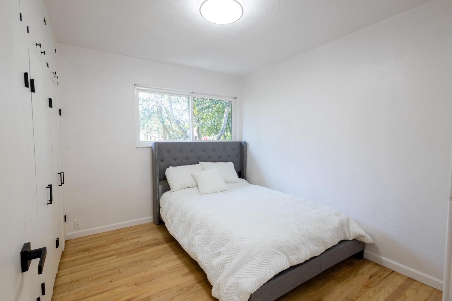 39 West Fulton Street Stockton, CA 95204 - Photo 15 of 31 a bedroom with a bed and a window