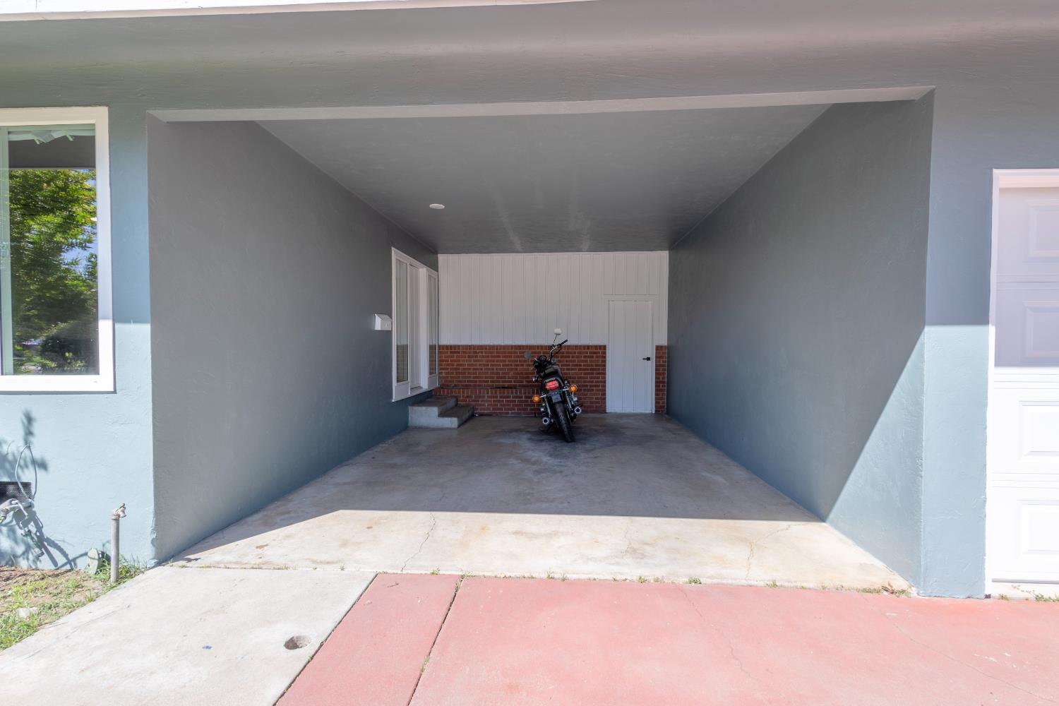 39 West Fulton Street Stockton, CA 95204 - Photo 2 of 31 a bed room with a bed and a window