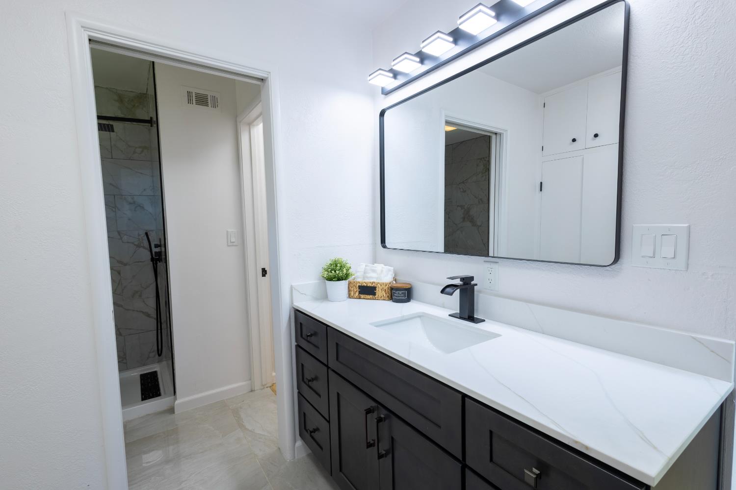39 West Fulton Street Stockton, CA 95204 - Photo 24 of 31 a bathroom with a sink vanity and mirror