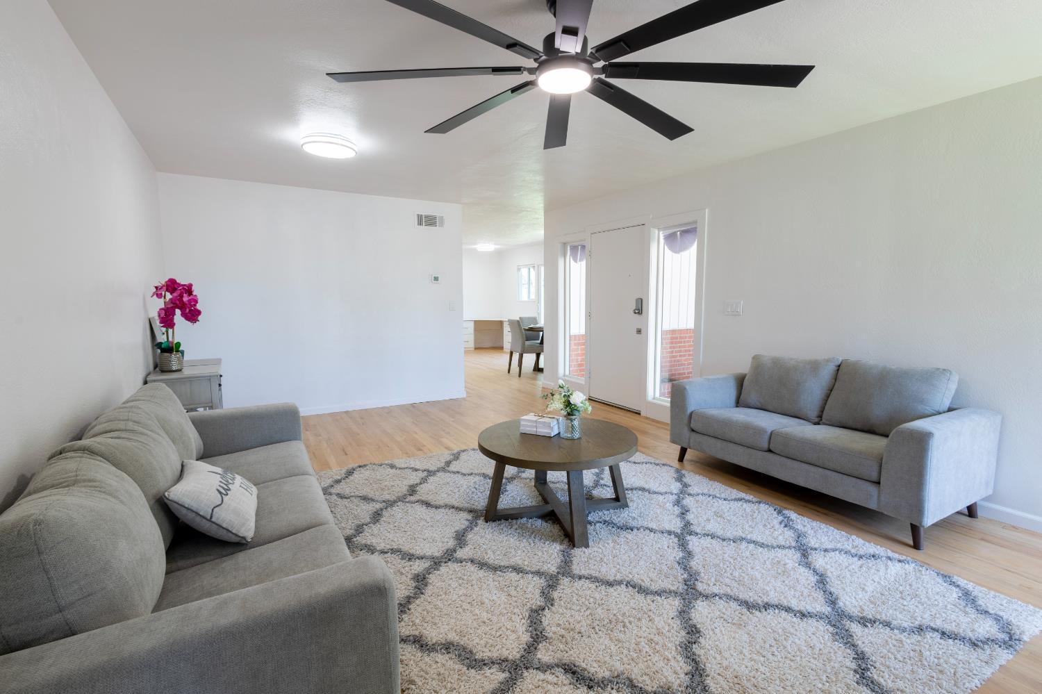 39 West Fulton Street Stockton, CA 95204 - Photo 4 of 31 a living room with furniture and a chandelier