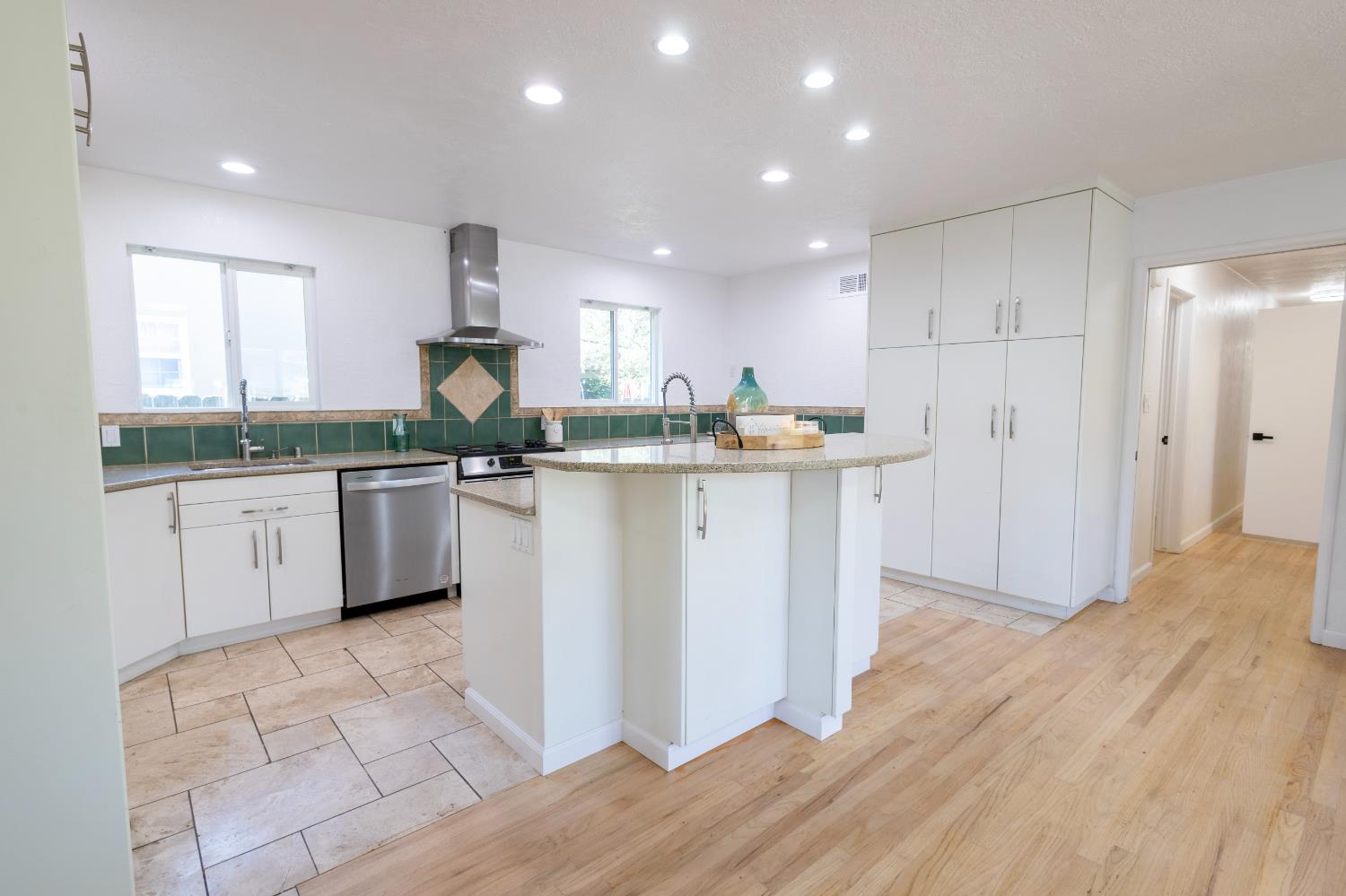 39 West Fulton Street Stockton, CA 95204 - Photo 5 of 31 a kitchen with stainless steel appliances granite countertop a sink and cabinets