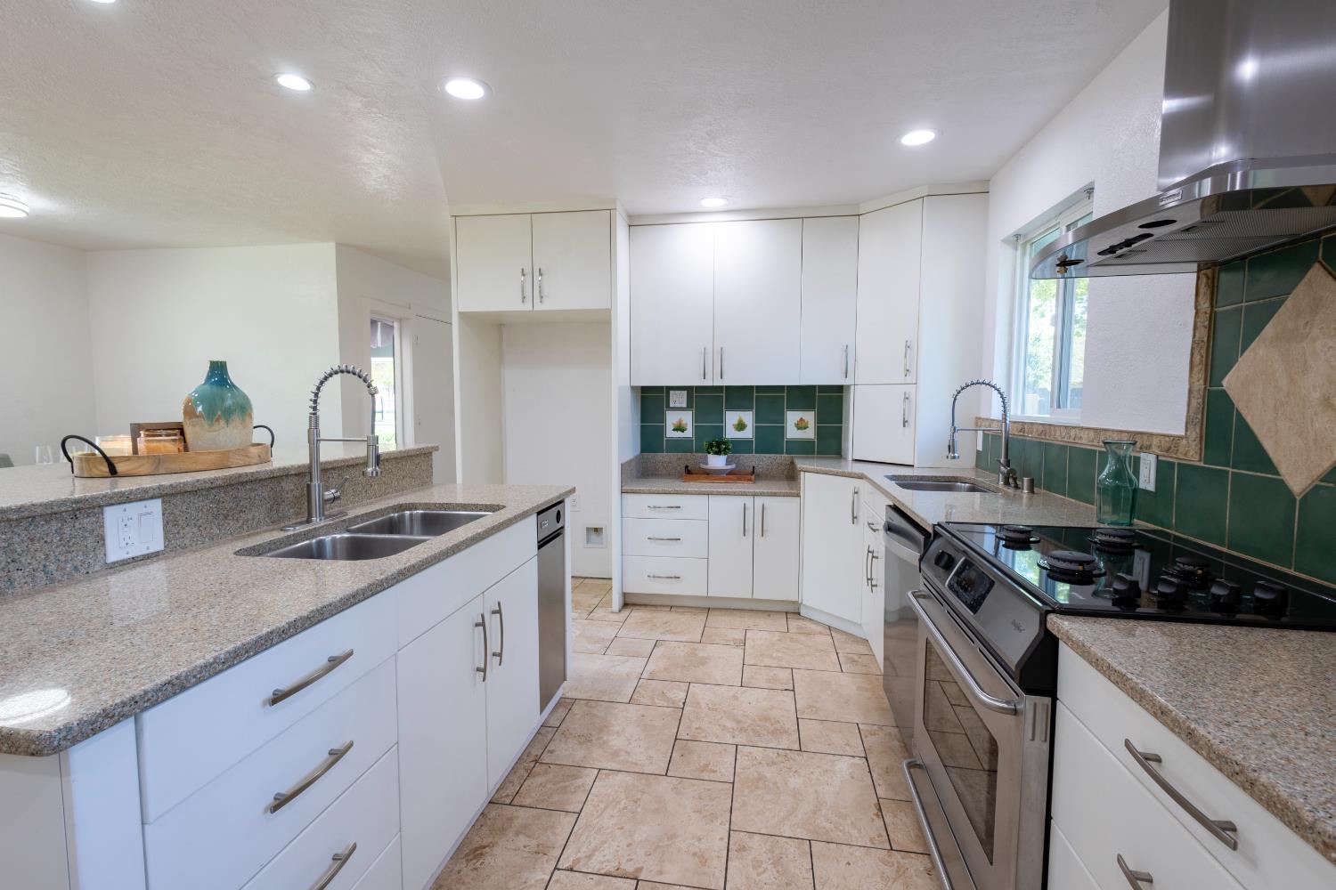 39 West Fulton Street Stockton, CA 95204 - Photo 9 of 31 a kitchen with stainless steel appliances granite countertop a sink stove and cabinets