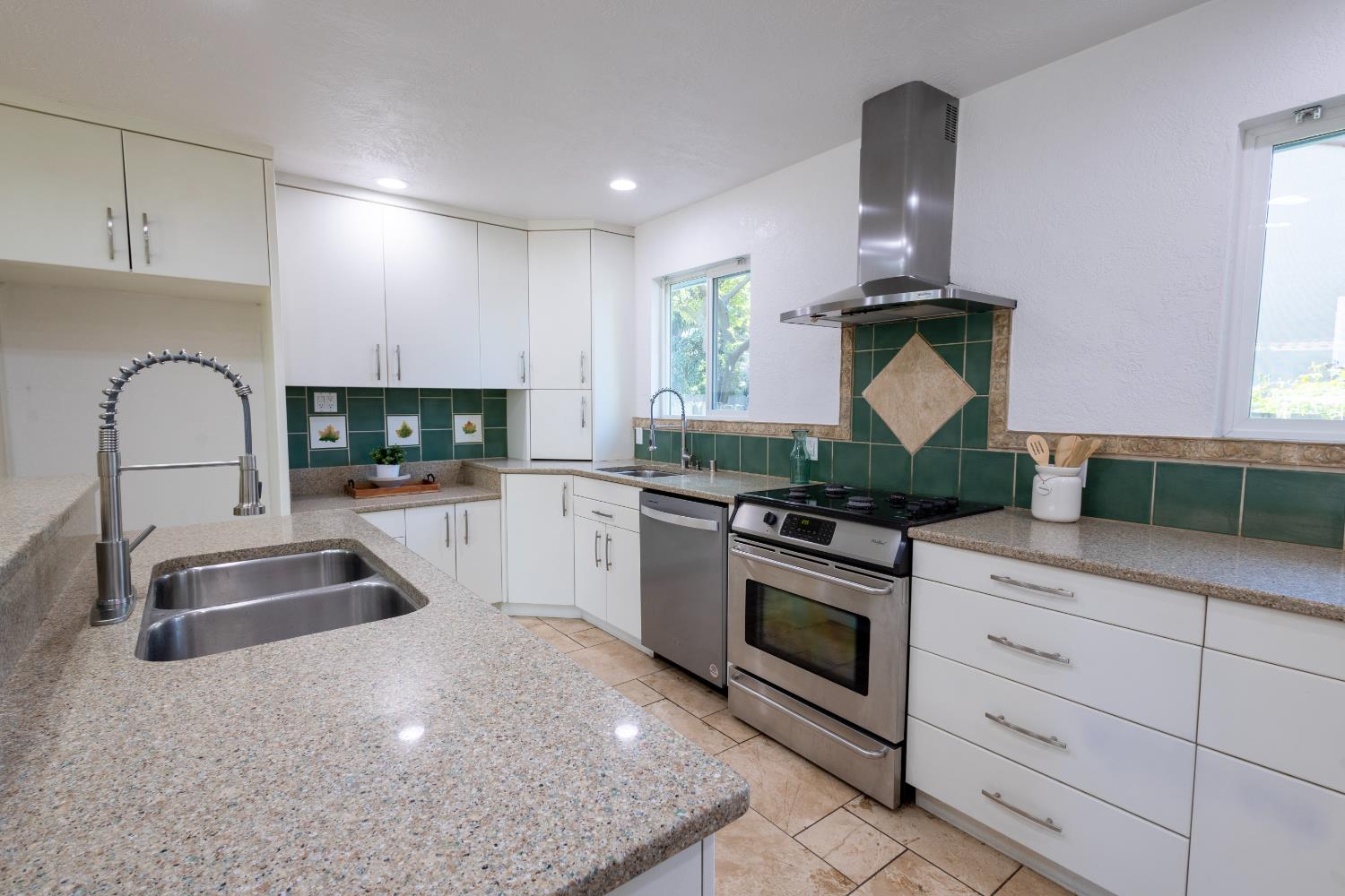 39 West Fulton Street Stockton, CA 95204 - Photo 10 of 31 a kitchen with stainless steel appliances granite countertop a sink stove and cabinets