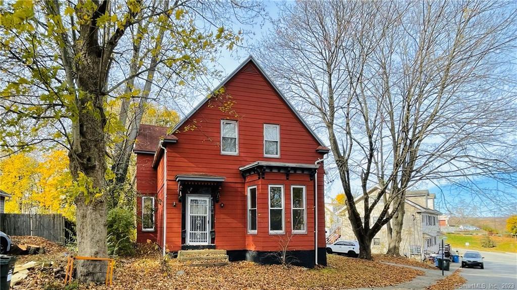 69 Summit Street Norwich, CT 06360 - Photo 1 of 1 a front view of a building with trees