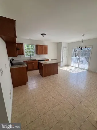 a living room with granite countertop furniture and fireplace