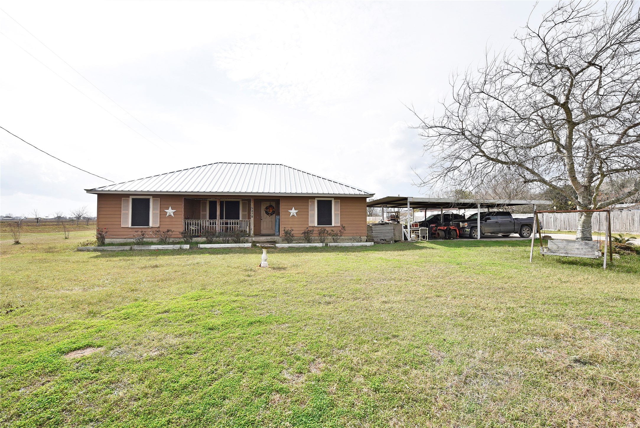 6018 FM 360 Road Needville, TX 77461 - Photo 13 of 50 a front view of a house with a garden
