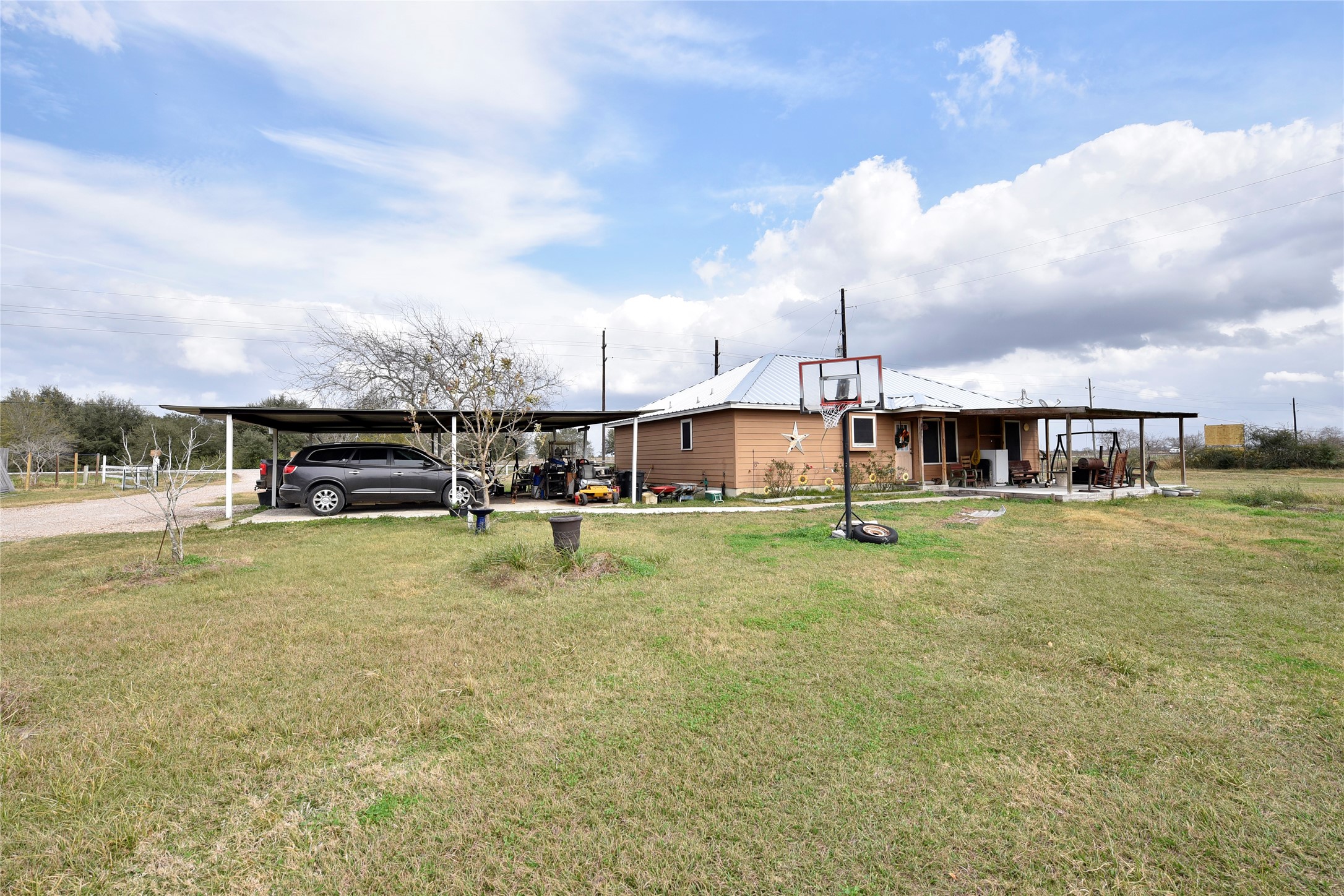 6018 FM 360 Road Needville, TX 77461 - Photo 27 of 50 a view of a lake with a house in the background