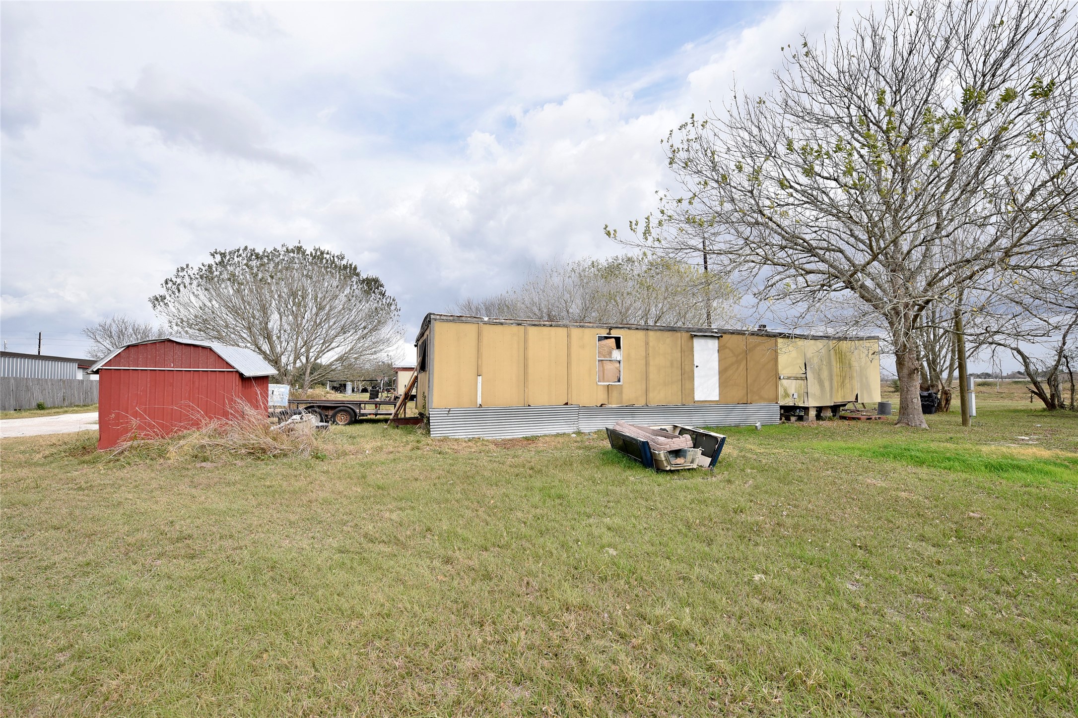 6018 FM 360 Road Needville, TX 77461 - Photo 33 of 50 a view of a house with a yard