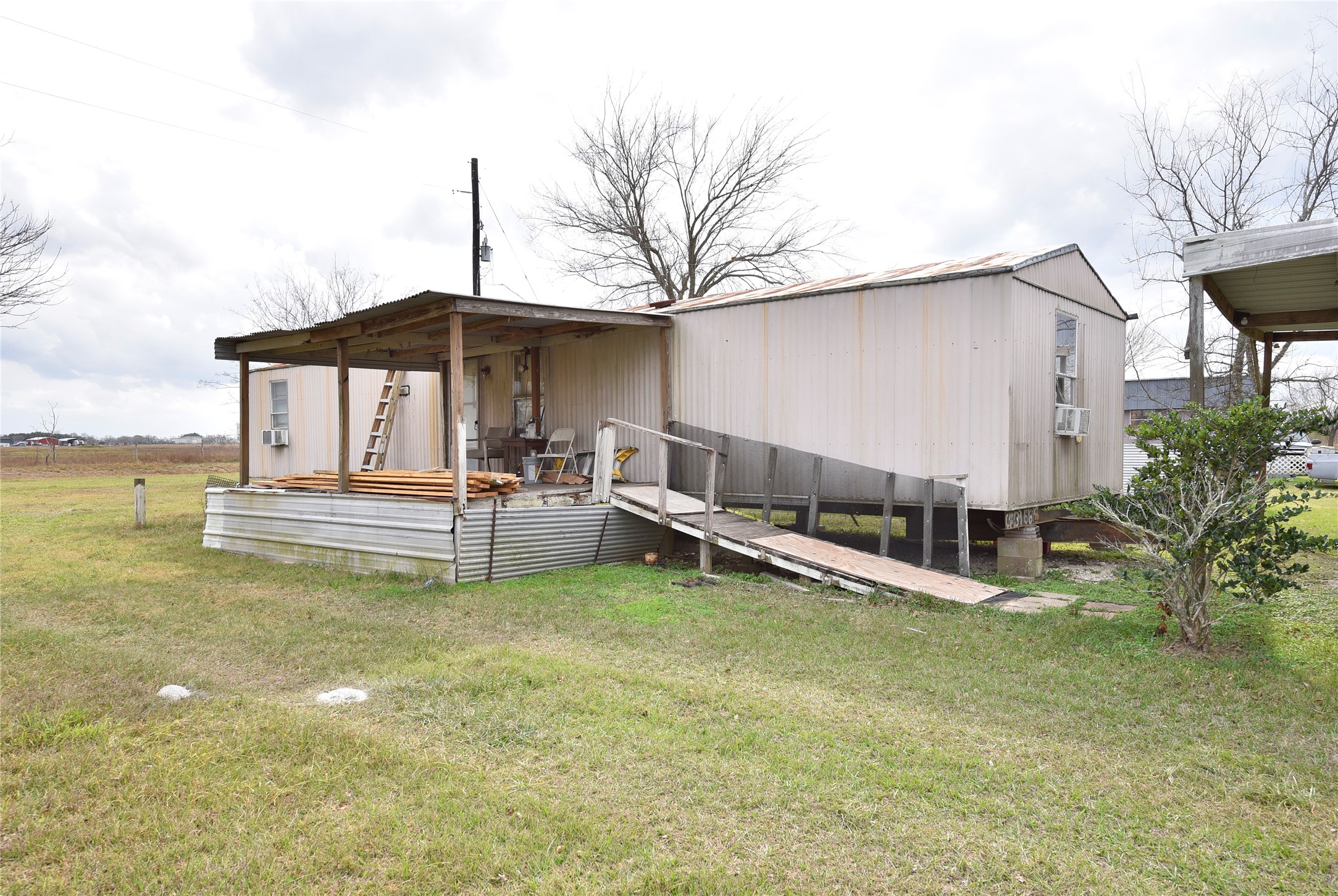 6018 FM 360 Road Needville, TX 77461 - Photo 35 of 50 a view of a house with swimming pool and sitting area