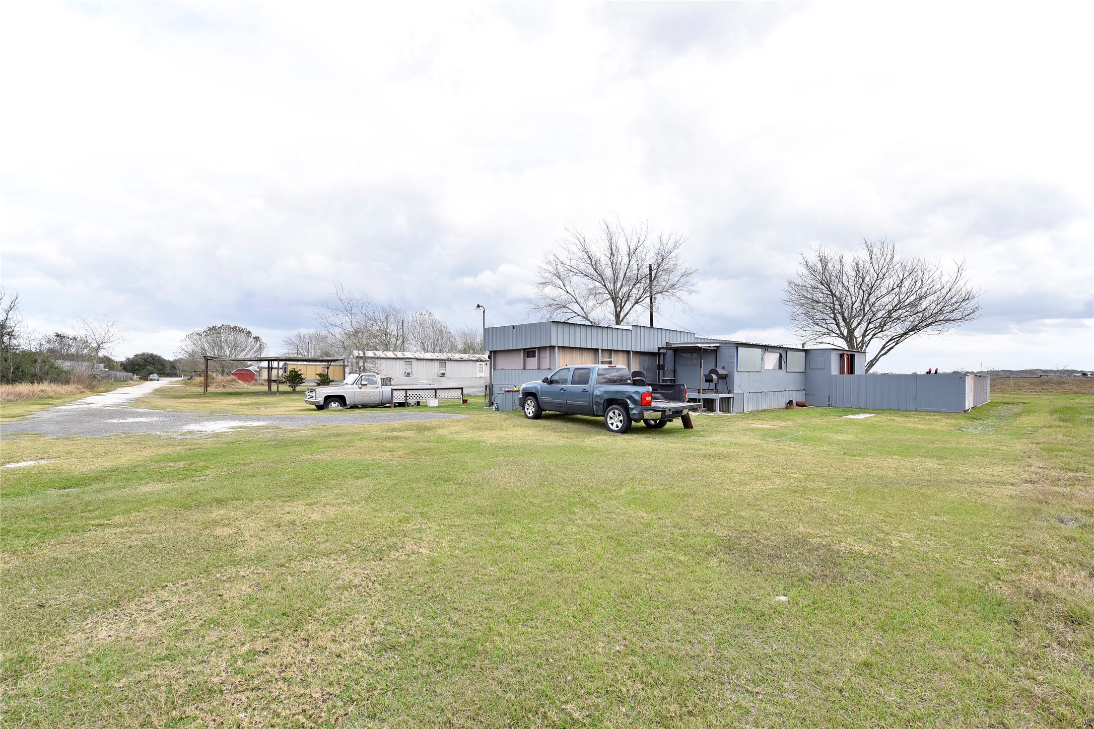 6018 FM 360 Road Needville, TX 77461 - Photo 39 of 50 a view of a swimming pool with a yard and sitting area