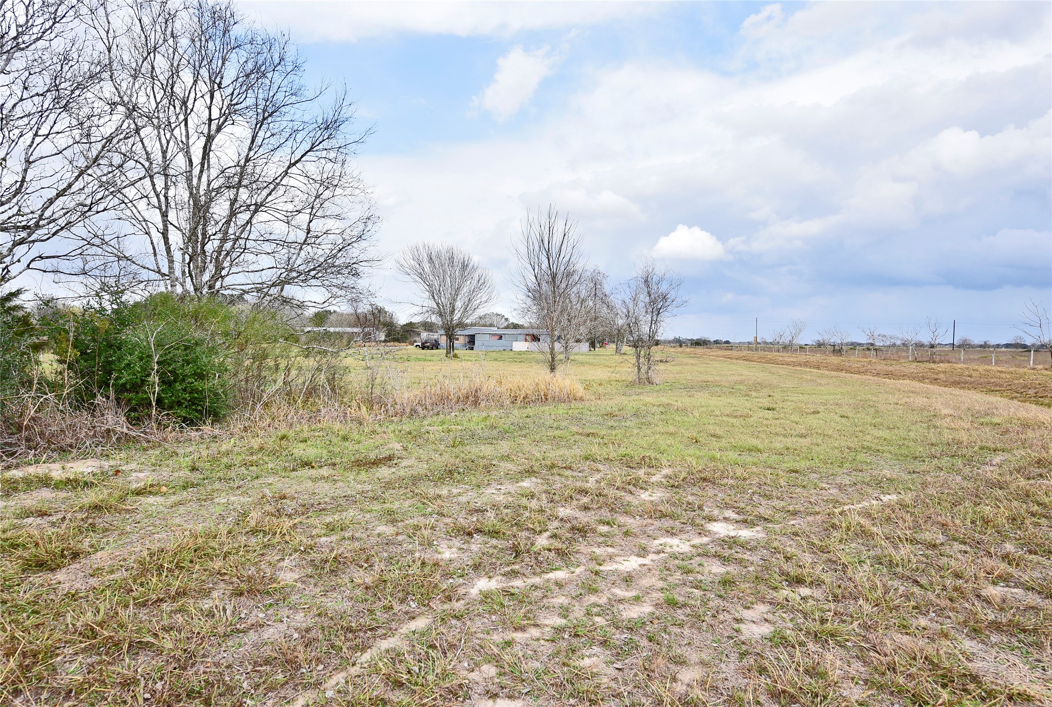 6018 FM 360 Road Needville, TX 77461 - Photo 45 of 50 a view of a lake with houses in the background