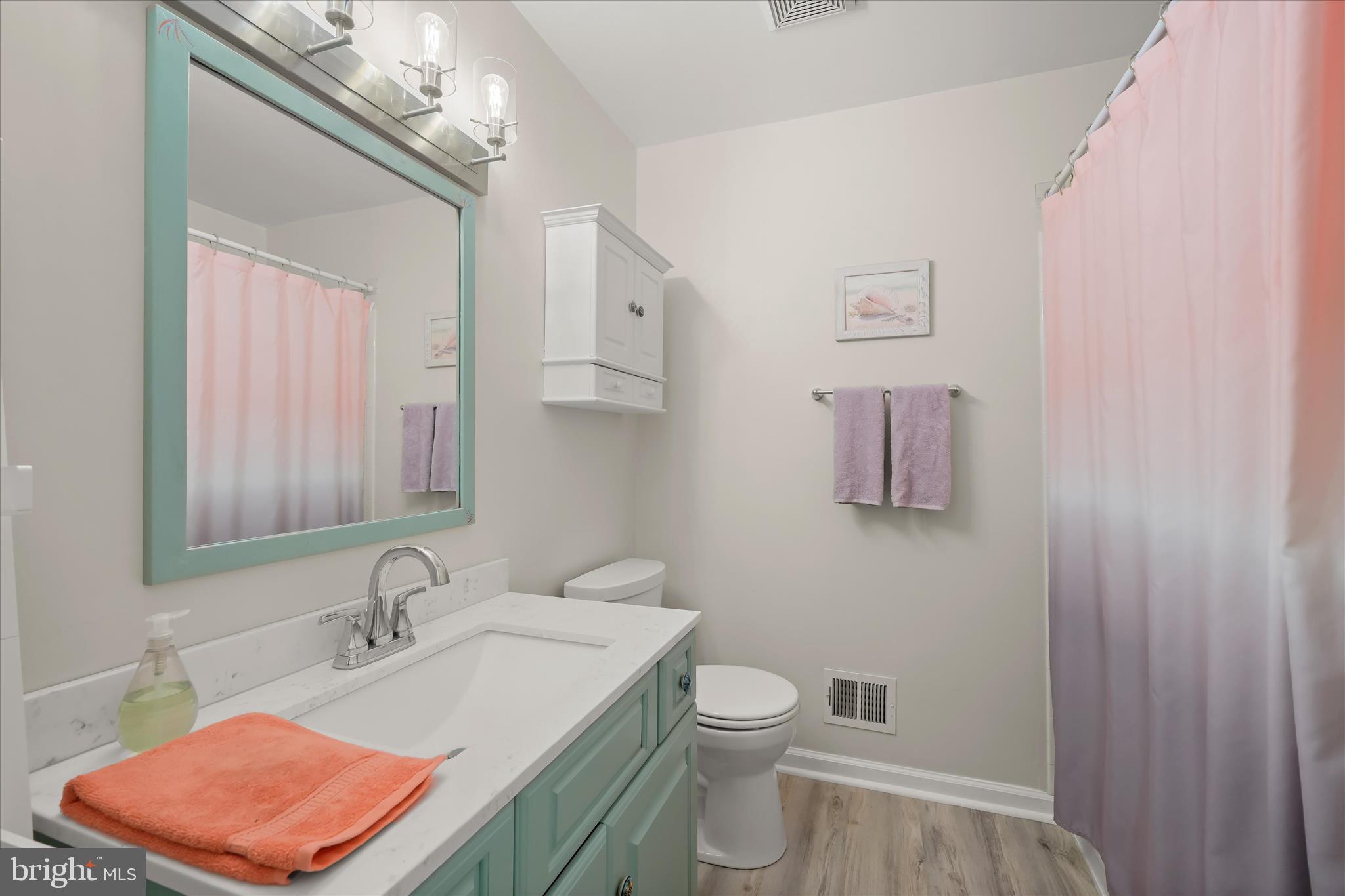 14821 Ridge Oak Drive Boyds, MD 20841 - Photo 30 of 49 a bathroom with a sink a toilet and mirror