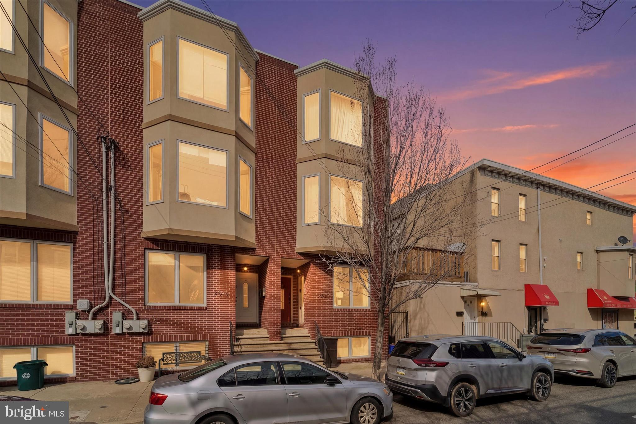 a view of cars parked in front of a building