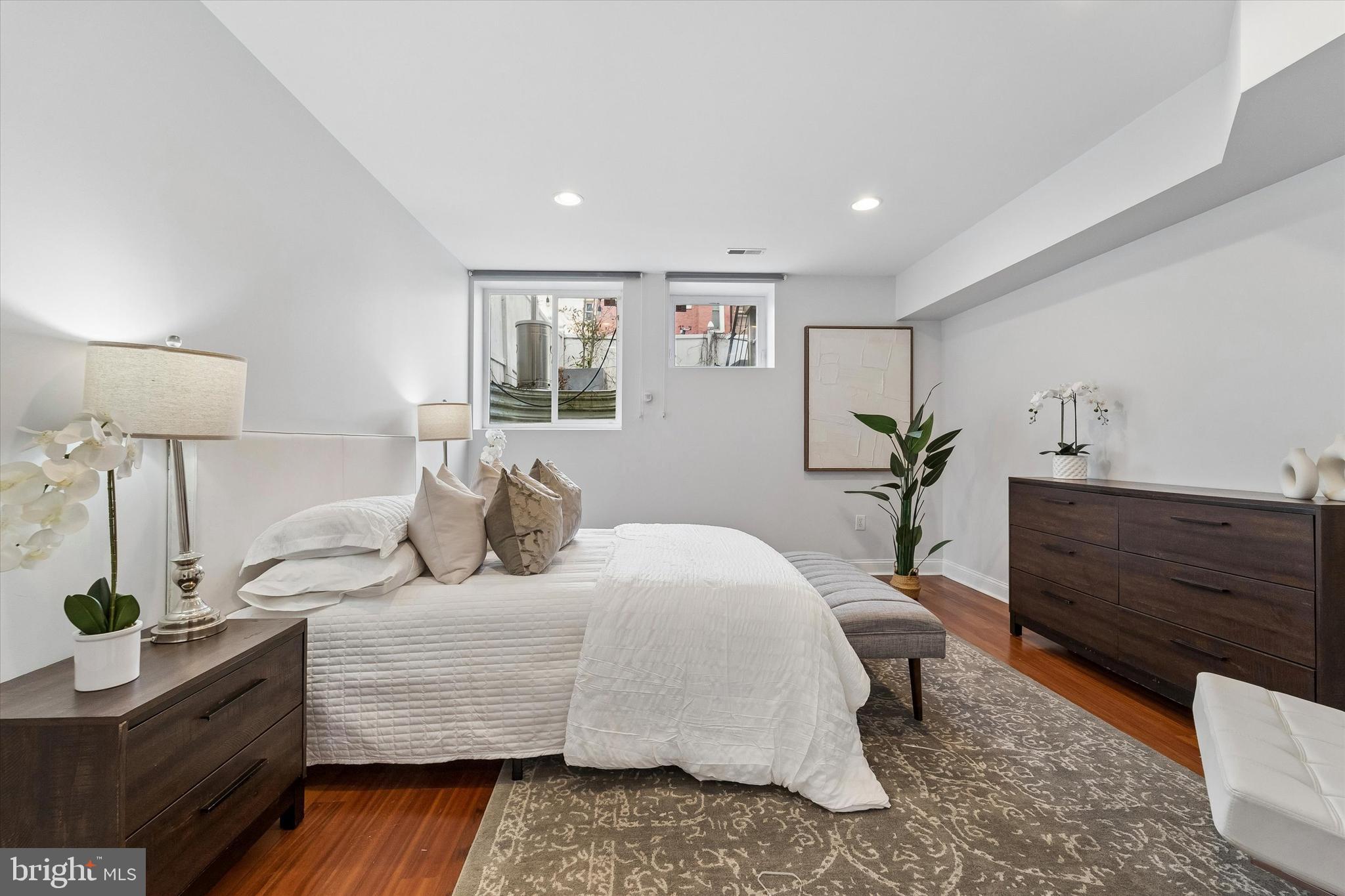 2001 Carpenter Street, Unit B Philadelphia, PA 19146 - Photo 15 of 31 a bedroom with a bed and wooden floor